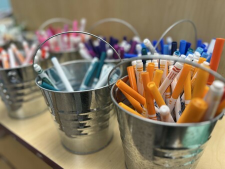 small craft pails holding markers